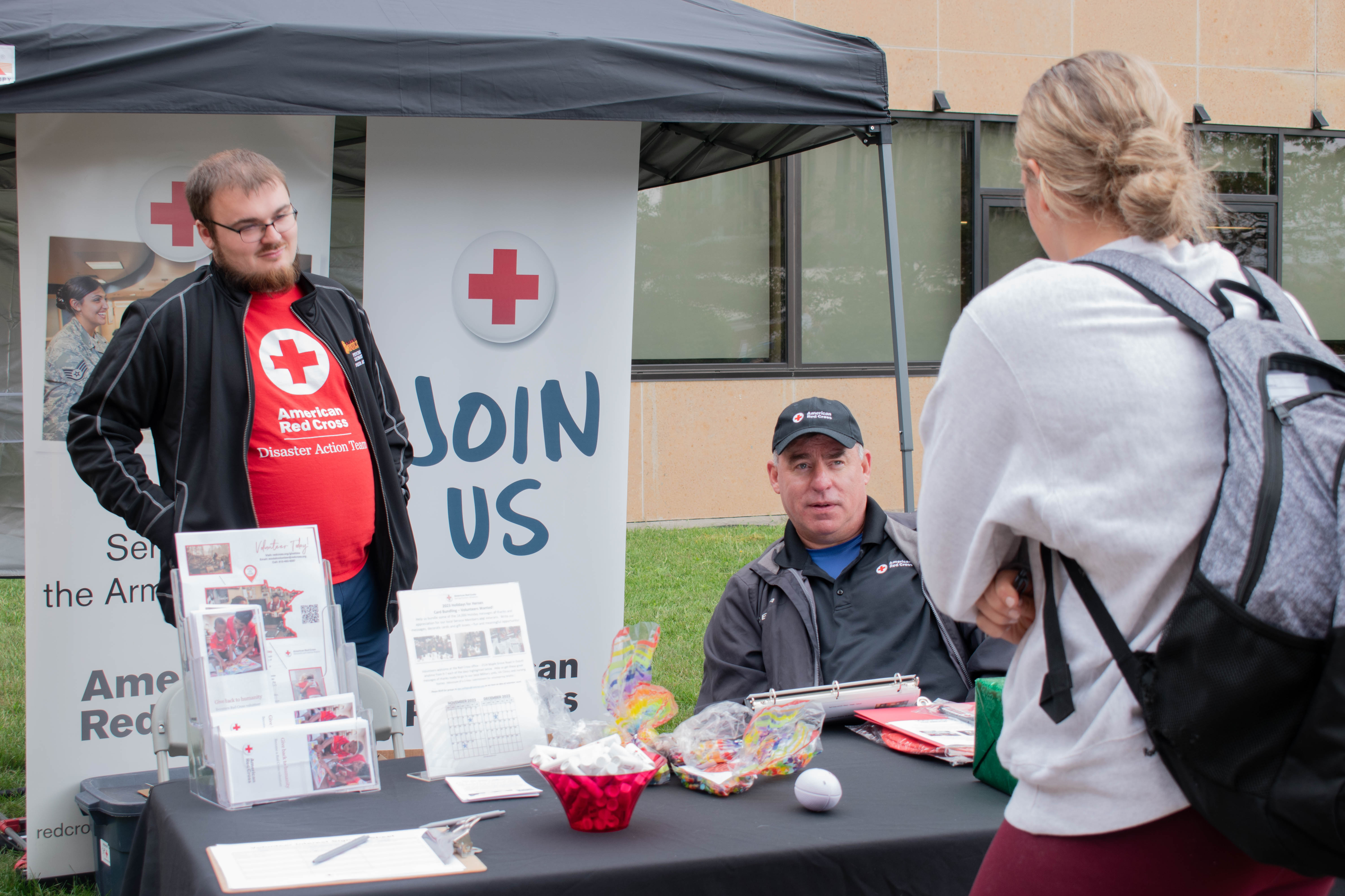 Student talks to representatives at the American Red Cross.